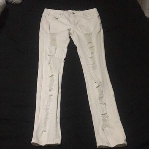Distressed white skinny jeans